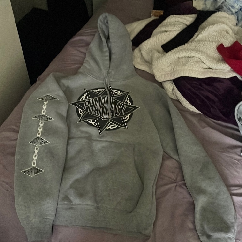 Grey pharmacy hoodie with design on the left sleeve and pocket